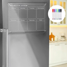Magnetic acrylic weekly planner on a fridge with six colorful markers and notes