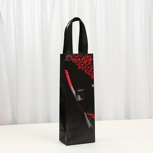 Detail of black non-woven wine bag with red wine bottle print and durable handle