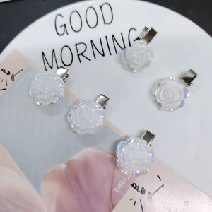 Five iridescent white camellia hair clips with pearl finish and metal duckbill clips