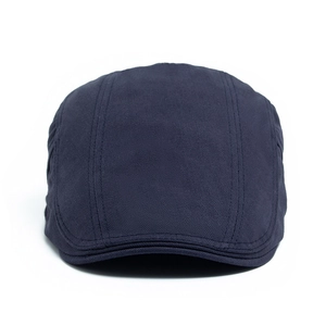 Classic dark blue herringbone flat cap for men in vintage British newsboy style