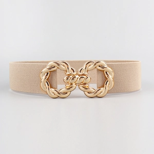 Close-up of beige elastic waist belt featuring a stylish gold twisted metal buckle detail