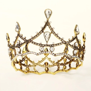 Detail of luxury bridal crown with antique gold finish and sparkling crystal rhinestones