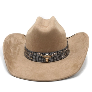 Detail of camel suede cowboy hat with grey studded band and golden bull head emblem