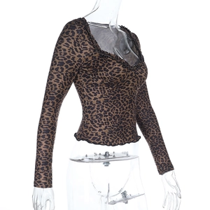 Leopard print long sleeve crop top with ruffled trim neck shown from a 45-degree angle