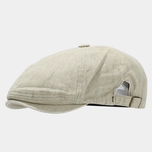 Detail view of washed cotton newsboy cap featuring an adjustable metal buckle and stitching