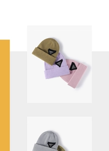 Detailed knit texture and color selection of winter ribbed beanies with logo patch