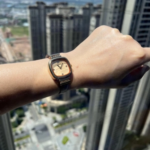 Fashionable square gold quartz watch with diamond accents and a brown leather strap
