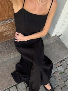 Minimalist black spaghetti strap long dress in cotton with high waist A-line fit