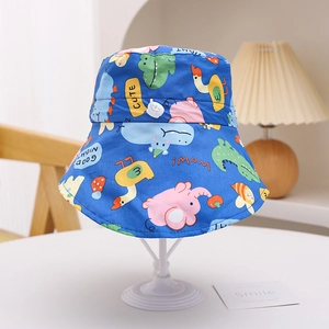 Detail of blue sun hat with wide brim showing colorful cartoon animal prints for kids