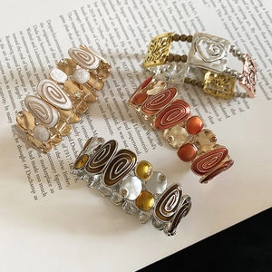 Detailed view of vintage enamel stretch bracelets with retro bohemian hollow patterns