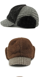 Detail of warm winter plaid baseball caps with faux fur earflaps and plush lining