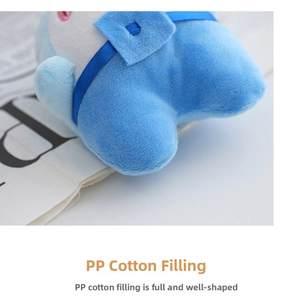 Close-up of soft blue plush fabric texture and resilient PP cotton filling detail