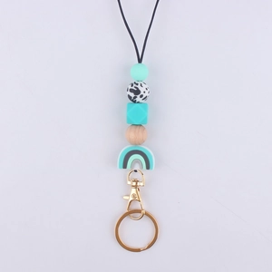 Detail of silicone beaded lanyard with mint rainbow charm and gold metal lobster clasp