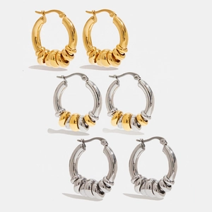 Three pairs of twisted stainless steel hoop earrings in gold, silver, and two-tone finishes