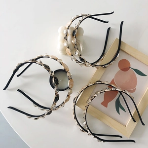 Detailed top view of thin vintage headbands with colorful crystals and rhinestones