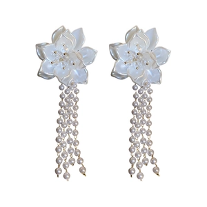 Elegant flower earrings with long pearl tassels and silver needles in creamy white
