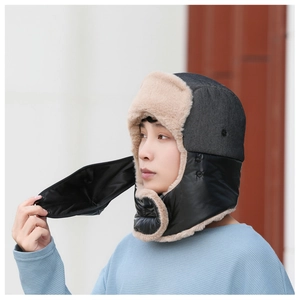 Detail of winter trapper hat with detachable mask and faux fur lining for wind protection