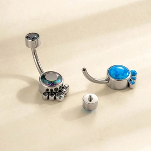 Titanium belly button ring with paw print zircon and blue opal inlay assembly