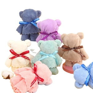 Cute bear-shaped coral fleece towels in various colors with decorative gift ribbons