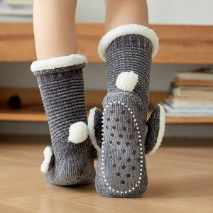 Grey knit winter floor socks with white faux fur trim and rabbit tail pom-poms