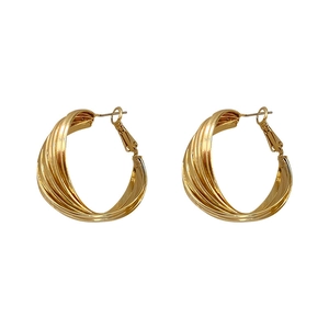 Chic twisted gold-plated geometric hoop earrings with a textured croissant-style design