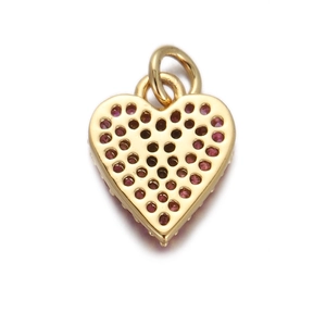 Detailed back view of gold heart charm with pink zircon and hollowed out metal design