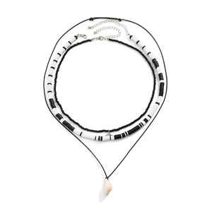 Multilayer hip hop necklace set featuring black beads, shell pendant, and clay discs