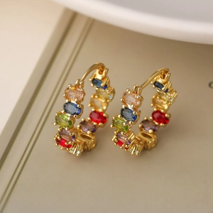 Golden geometric hoop earrings with vibrant multi-colored zirconia stones in a luxury finish