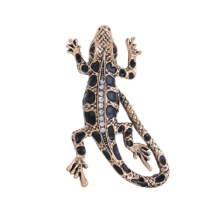 Vintage lizard brooch with gold finish, black enamel, and sparkling rhinestones