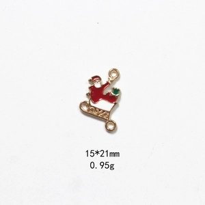 Detail of Santa Claus enamel alloy charms with dual loops for DIY jewelry making