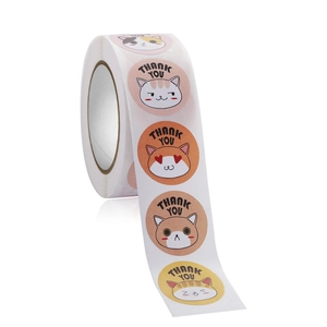 Detail of round cartoon cat Thank You stickers on a roll for packaging and decor