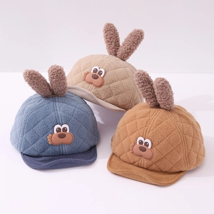 Detail of plush baby baseball cap featuring cute rabbit ears and soft quilted fleece texture