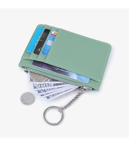 Close-up of mint green cross-grain leather card holder with zip pocket and key ring