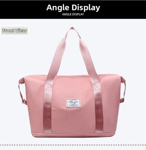 Front view of a large pink waterproof travel bag with double handles and logo patch