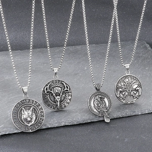 Viking stainless steel pendants featuring wolf, deer, raven and tree of life on dark stone