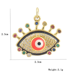 Detail of a 2.3cm gold evil eye pendant with colorful stones, weighing 3.1g