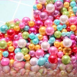 Macro shot of assorted colorful high-gloss no-hole ABS imitation pearls for DIY crafts
