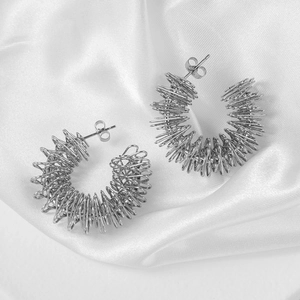 Retro stainless steel twisted spring hoop earrings in silver finish with C-shape design