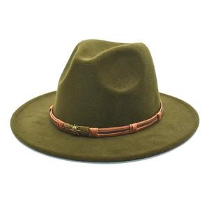 Detail view of army green fedora featuring a braided leather band and skull metal ornament
