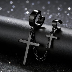 Macro detail of black stainless steel cross earrings set with connecting chain link