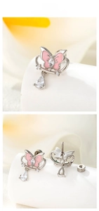 Detail showing pink enamel butterfly earrings with marquise zircon and drop pendant