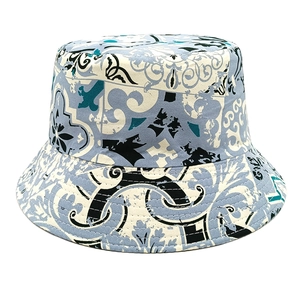 Detail shot of vintage pattern bucket hat with intricate blue and green floral tile design