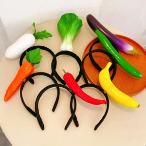Whimsical vegetable headbands set featuring large carrot chili and cabbage designs