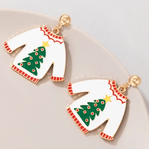 Macro view of white Christmas sweater earrings with green tree and gold stud detail