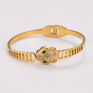 Vintage hollow gold leopard head bangle in stainless steel with green crystal eyes