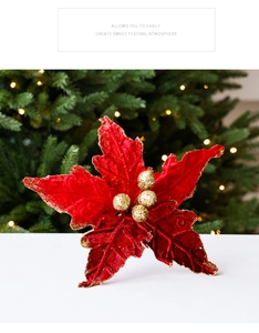 Vue détaillée d'une fleur de Noël en velours rouge avec paillettes dorées et lumières