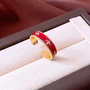 Vintage 18k gold plated open flower ring with red enamel and zircon accents