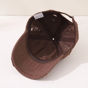 Detail view of cotton inner lining and adjustable metal buckle on vintage kids baseball cap