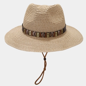 Detail of straw Panama hat featuring shell beaded band and adjustable chin strap