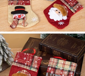Detailed view of Christmas stocking set featuring 3D Santa, Snowman and Reindeer motifs